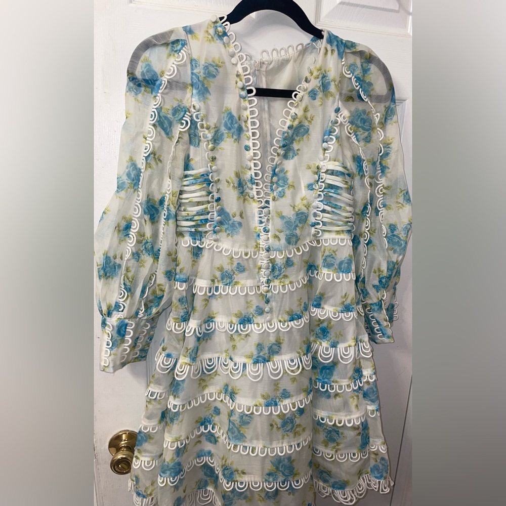 Floral one of a kind dress .A compliment getter .Luxurious fabric.Zero flaws